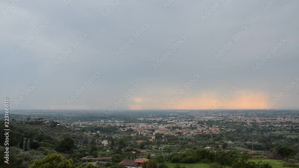 View of the city from the mountain with stormy, rain clouds View of the city from the mountain with stormy, rain clouds