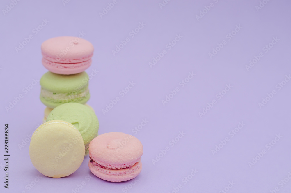 Dessert macaroons on a purple background. Dessert macaroons on a purple background.