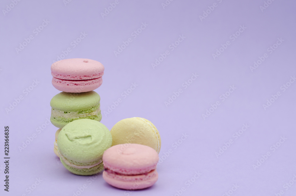 Dessert macaroons on a purple background. Dessert macaroons on a purple background.