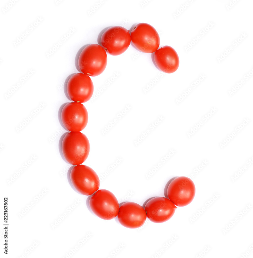 Obraz premium The letter C is made of tomato. Symbol of the English alphabet of tomato on a white background.