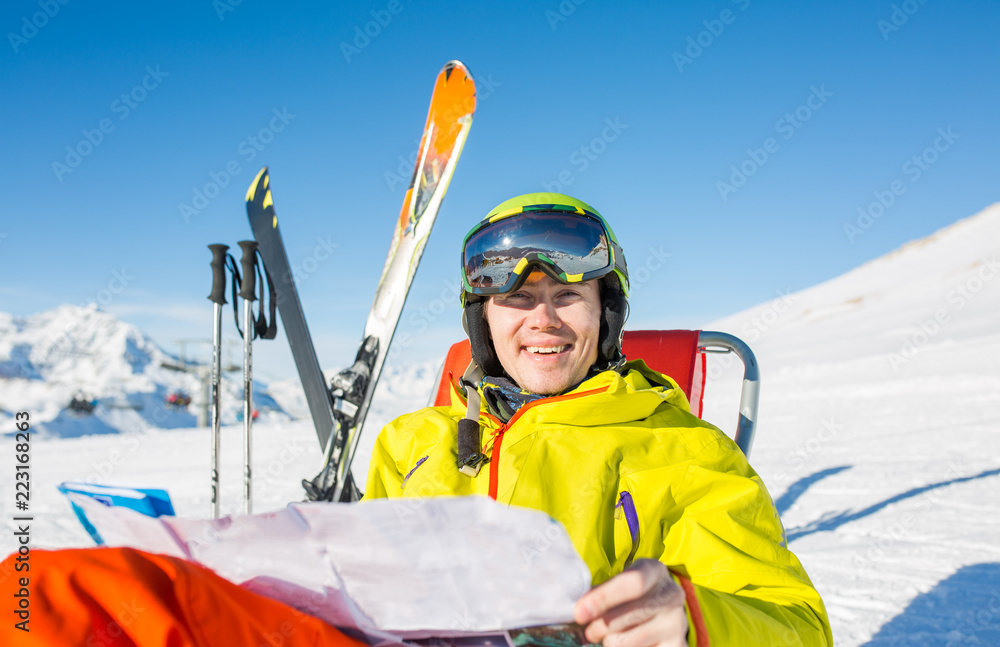 Photo of sporty man in helmet sitting at chair