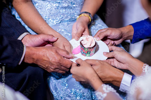  wedding cakes on dish. Bride and groom giving slice of wedding cake to guest. sign of wedding ceremony and sign of  wedding ceremony process ending.