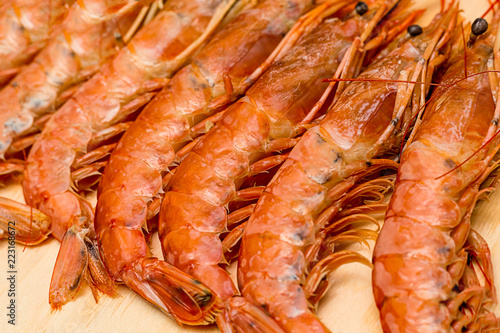 long appetizing langoustines lots of fresh delicacies on a wooden board background culinary base prepare seafood