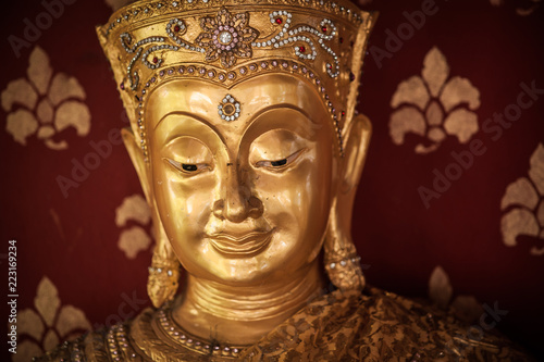 Closeup of Buddha statue at Buddhist temple, Chiang Mai, Thailand © guruXOX