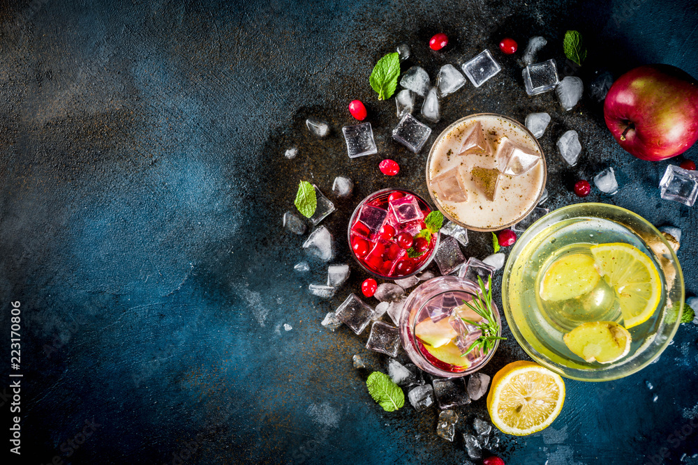 Various autumn winter seasonal alcohol cocktail Apple Rosemary, Cranberry vodka, Ginger lemon ale, Almande Horchata, Kahlua Cacao, dark blue background copy space Various autumn winter seasonal alcohol cocktail Apple Rosemary, Cranberry vodka, Ginger lemon ale, Almande Horchata, Kahlua Cacao, dark blue background copy space