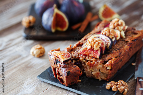 Homemade delicious fig cake with nuts on board