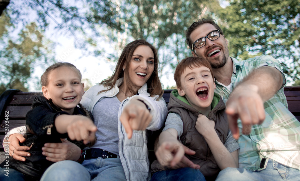 Obraz premium close up.smiling family pointing at you