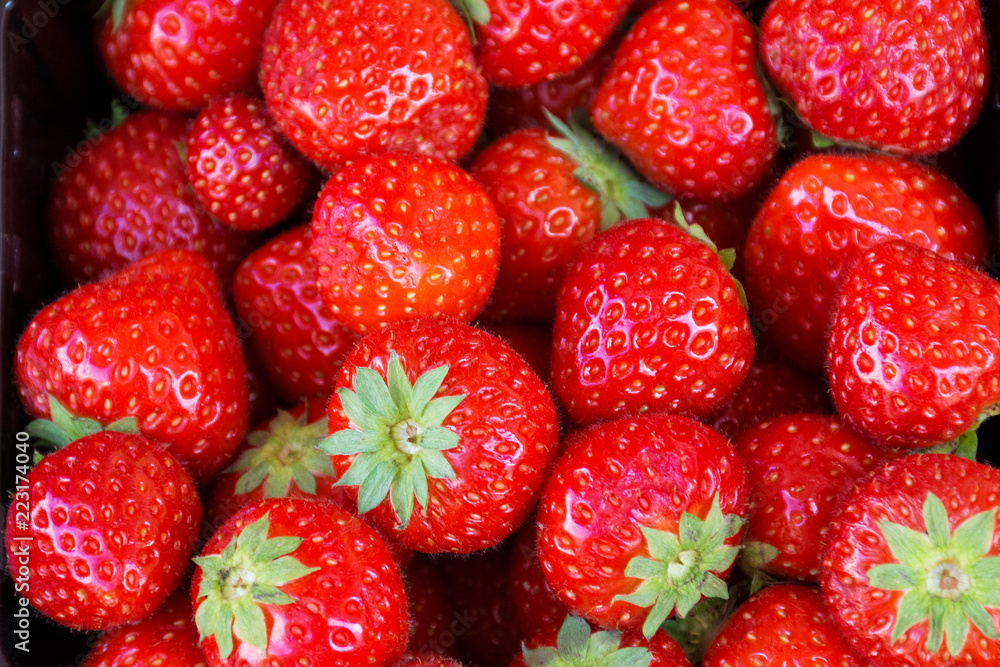 garden strawberry a lot of ripe, juicy berries close-up, background garden strawberry a lot of ripe, juicy berries close-up, background