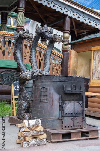 Steel stove, stylized in the form of a dragon