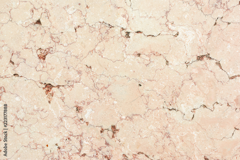 Light beige background with marble texture. Plate of natural stone with veins.