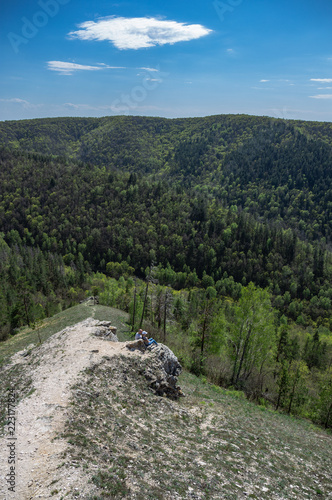 Tourists on the rock in mountains photo