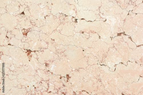 Light beige background with marble texture. Plate of natural stone with veins.