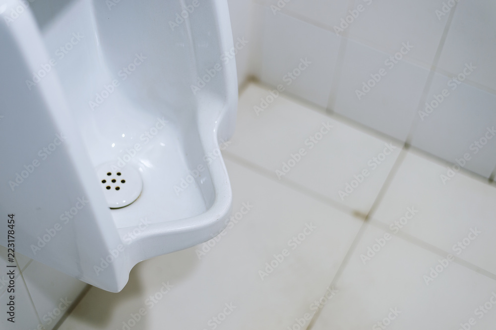 Fototapeta premium closeup old urinals (chamber pot) in toilet with soft-focus in the background. over light