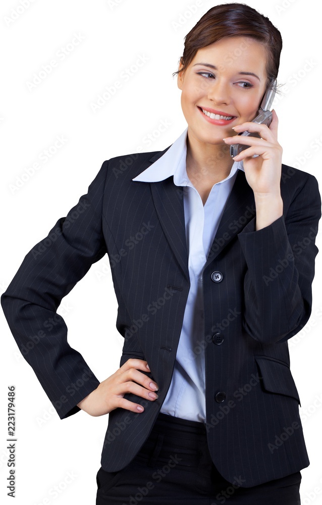 Businesswoman Talking on the Phone with Hand on Hip - Isolated Businesswoman Talking on the Phone with Hand on Hip - Isolated