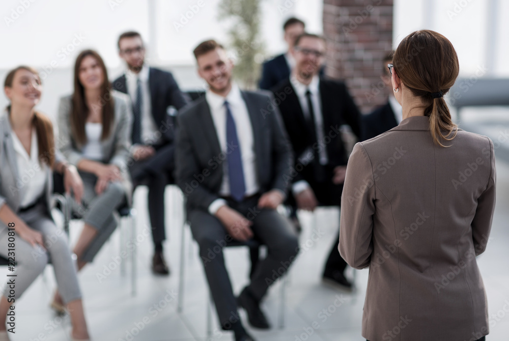 business woman holds a briefing for employees business woman holds a briefing for employees