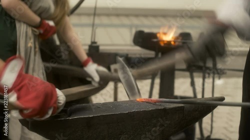 Blacksmiths Shaping and Polishing Iron photo