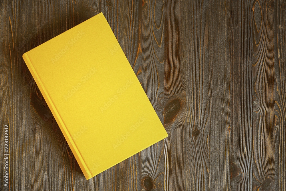 Fototapeta premium Yellow book on the table