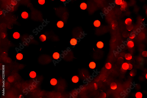 Abstract red christmas bokeh lights isolated on black background. Christmas tree light background. New year decorations. Abstract lights on black. Winter theme.