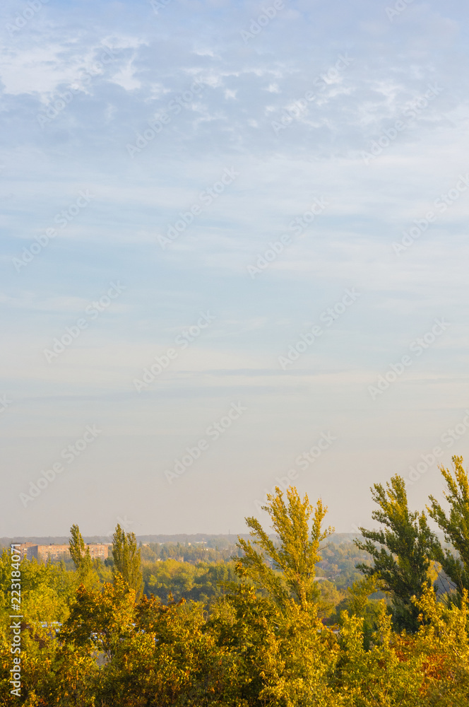 Fototapeta premium Autumn landscape with colorful trees in sunlight