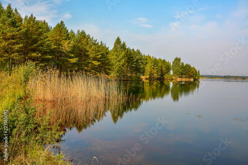 Fototapeta Naklejka Na Ścianę i Meble -  Artificial lake formed after the removal of sand. Closed sand quarry.