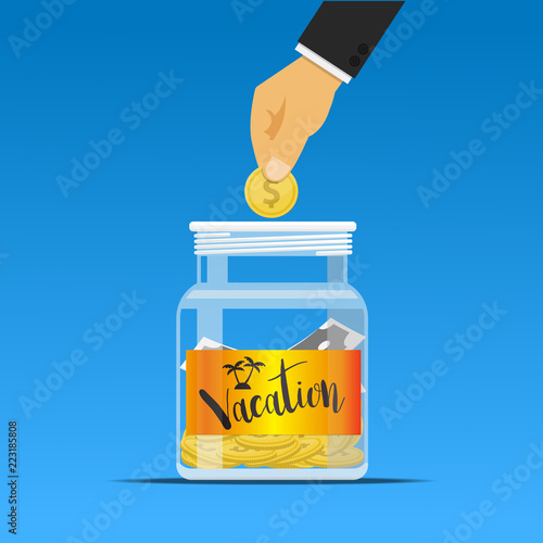 Hand dropping a coin into the vacation jar.
