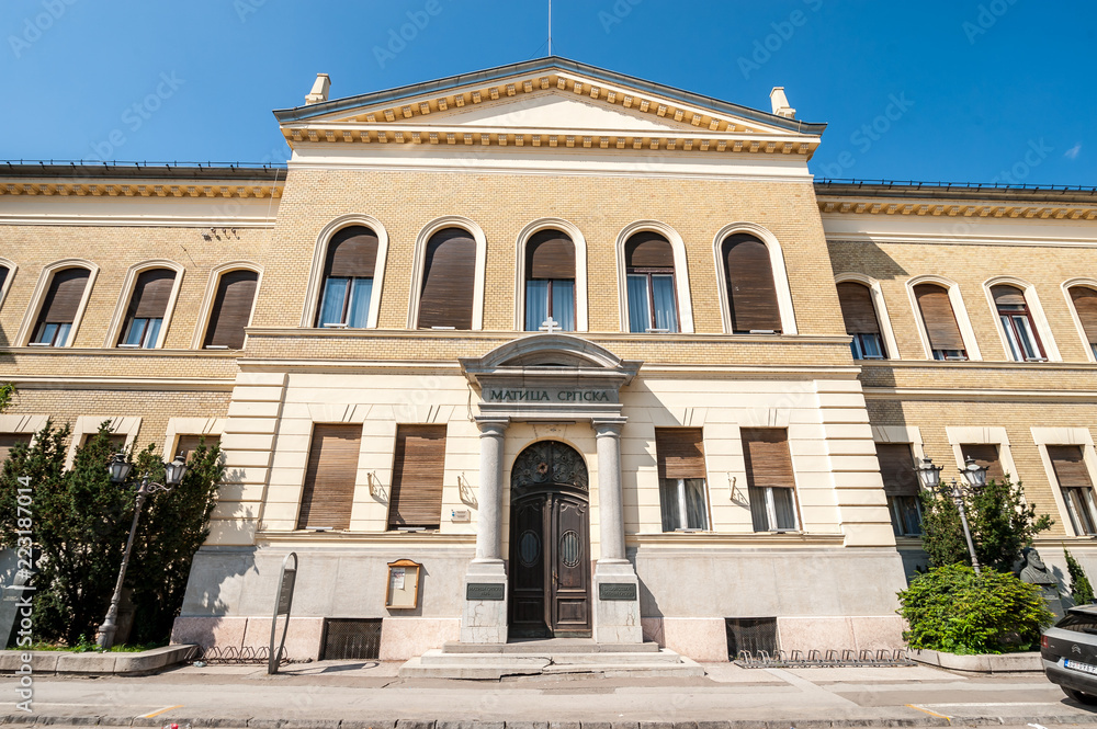 Entrance windows and front facade of historical building of Matica Srpska translation - Serbian Association, built in 1826.