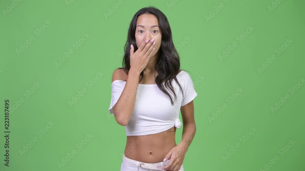 Young beautiful multi-ethnic woman looking shocked Young beautiful multi-ethnic woman looking shocked