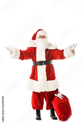 emotional santa claus with sack gesturing with hands isolated on white