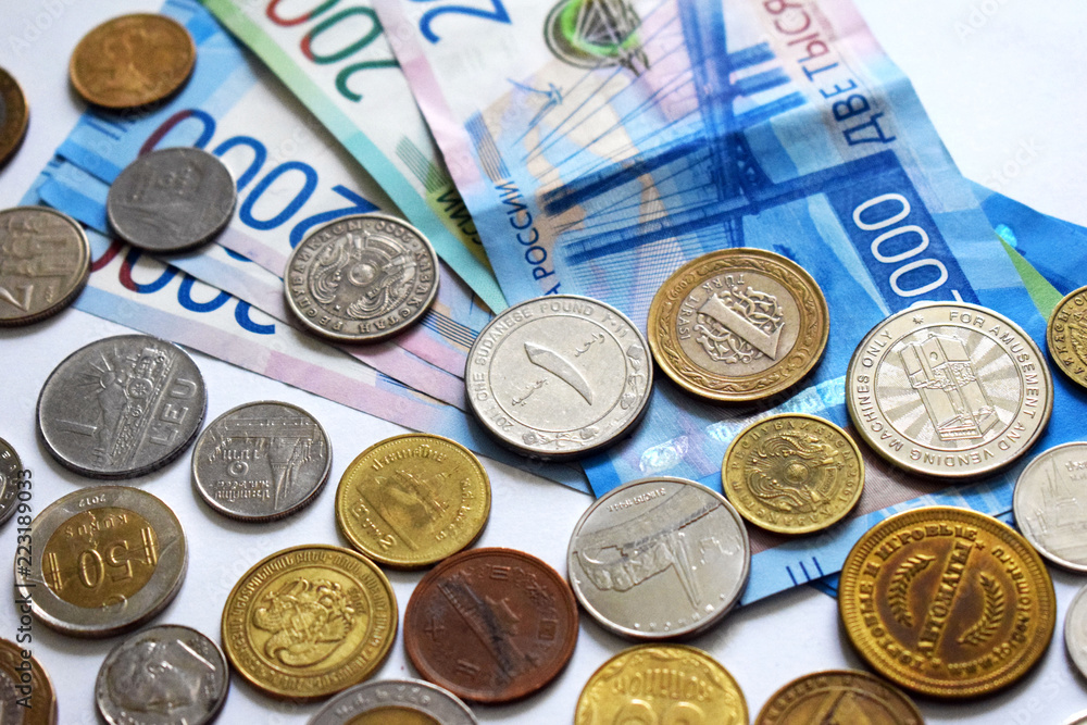 Money from different countries. Russian banknotes. Two thousand rubles. Metal ancient coins. Loose change. Income and savings. Money from different countries. Russian banknotes. Two thousand rubles. Metal ancient coins. Loose change. Income and savings.
