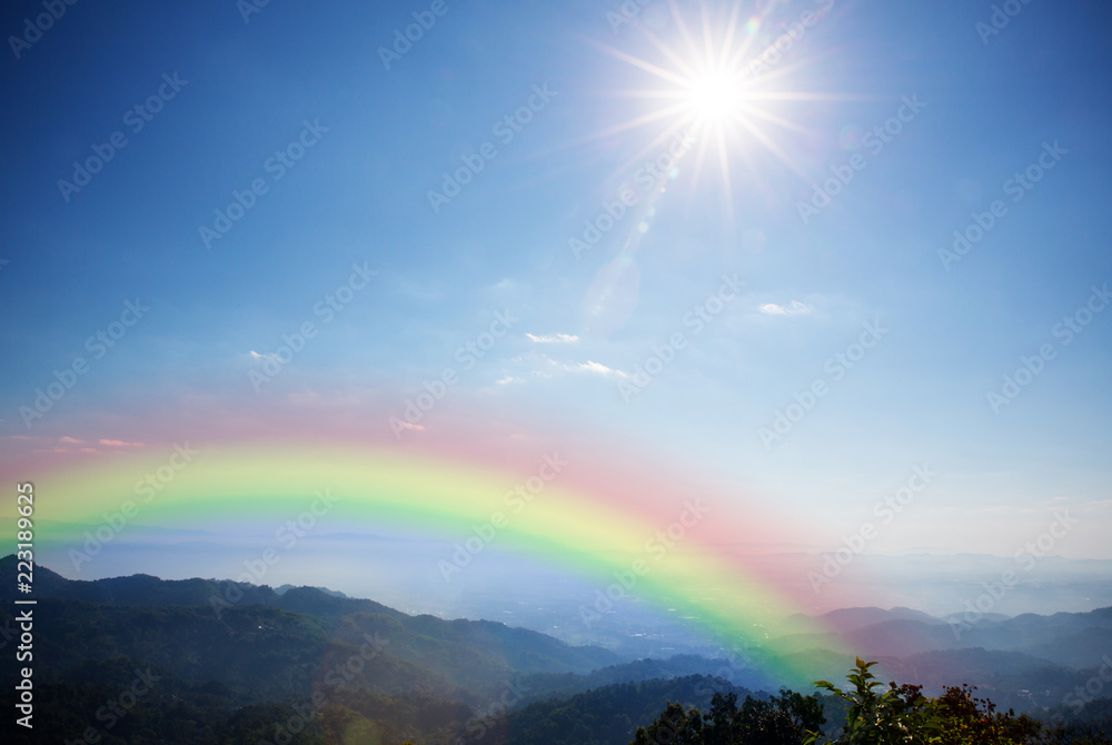 Landscape, mountain hill sun beam and lighting blue sky with rainbow. beautiful nature background and wallpaper. Landscape, mountain hill sun beam and lighting blue sky with rainbow. beautiful nature background and wallpaper.