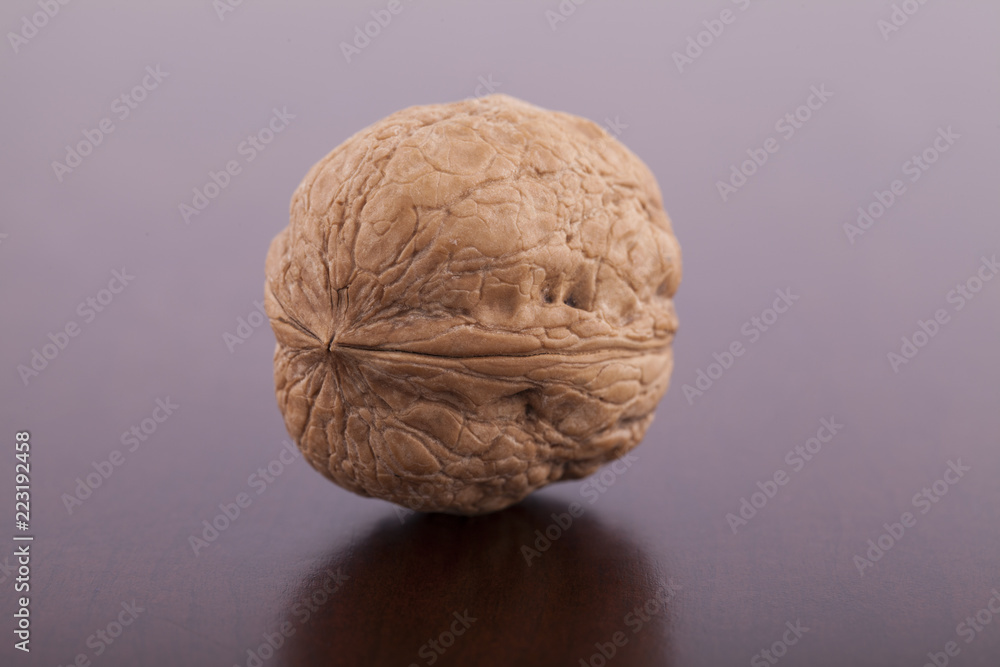 Fototapeta premium Walnut on wooden background close up