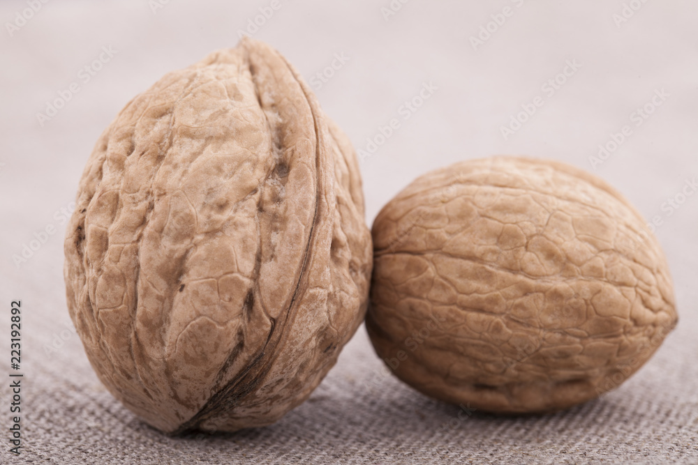 Walnuts on textile background close up group Walnuts on textile background close up group