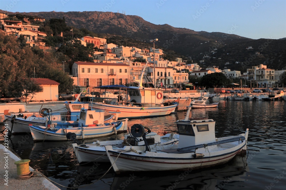 postcard picture greek port with traditional fisher boats in Agios Kirykos on Ikaria Island