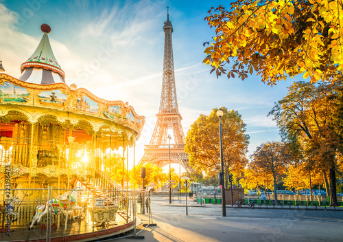 Eiffel Tower with merry go round from Trocadero at fall sunrise, Paris, France, toned