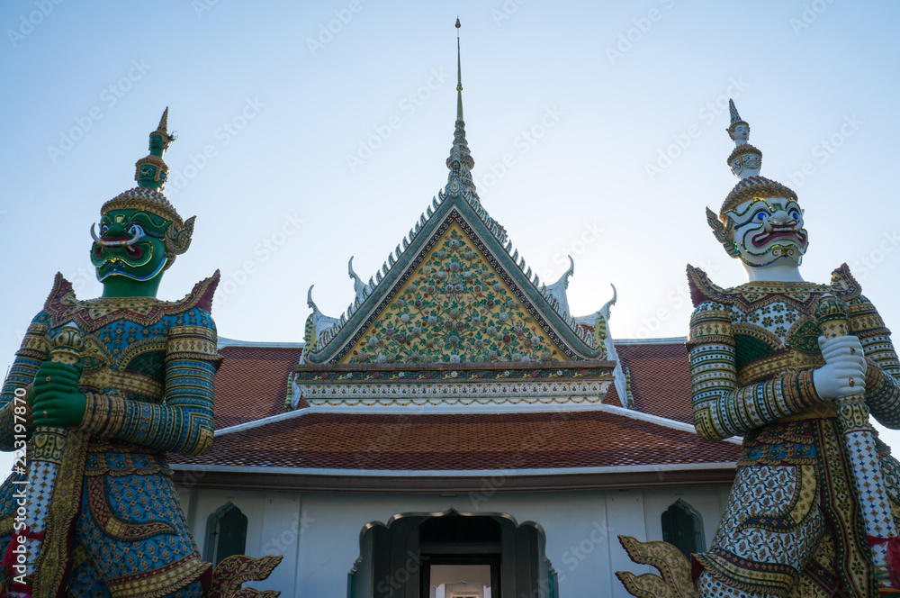 Naklejka premium Demon (Giant or Yak) guardians at the Temple of Dawn (Wat Arun Ratchawararam Ratchawaramahawihan or Wat Arun), Bangkok