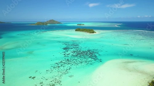 Aerial footage from a drone of blue lagoon and Motu Ahuna at Bora Bora island, Tahiti, French Polynesia, South Pacific Ocean (Bora Bora Aerial)
 photo