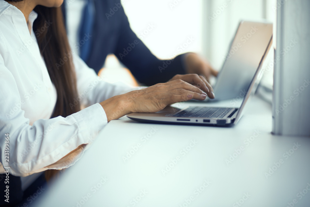 Colleagues making report on laptop. Preparing for meeting. Business concept. Colleagues making report on laptop. Preparing for meeting. Business concept.