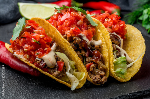 Mexican tacos with beef and salsa photo