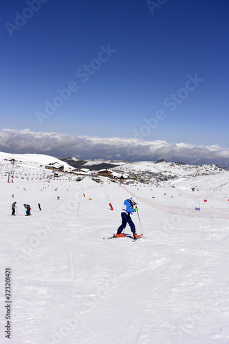 On the snow-capped peaks of the mountain Sierra Nevada skiers and snowboarders