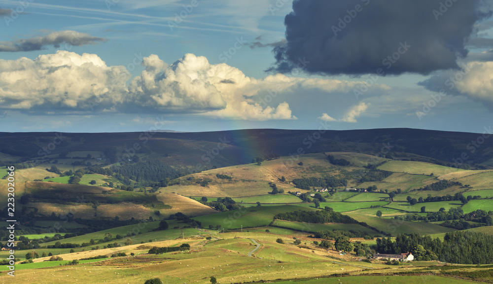 Rainbow over Scenic Countryside Fields in UK