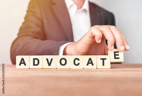 Man made word ADVOCATE with wood blocks