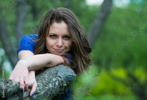 Beautiful young girl walking in spring Park