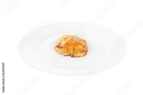 Meat, pork, beef, chicken, fish baked under a crust of mayonnaise and cheese on a plate, isolated on white background. Side view. Serving for a cafe, a restaurant in the menu