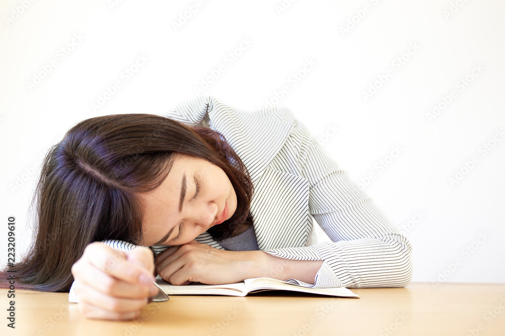 Business women laying on the wooden table after hard working over the day Business women laying on the wooden table after hard working over the day
