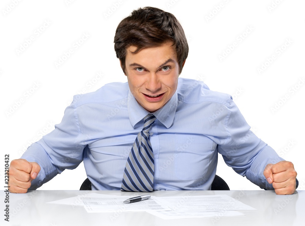 Angry Businessman Sitting at the Desk - Isolated Angry Businessman Sitting at the Desk - Isolated
