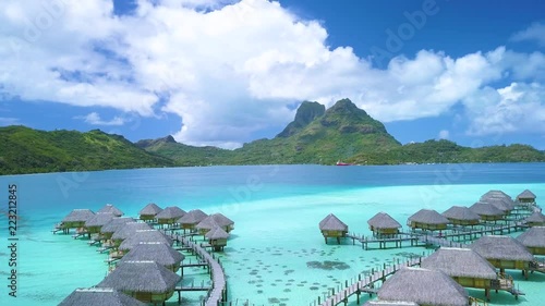 Wallpaper Mural Aerial footage from a drone of luxury overwater villas with palm trees, blue lagoon, white sandy beach and Otemanu mountain at Bora Bora island, Tahiti, French Polynesia (Bora Bora Aerial)
 Torontodigital.ca
