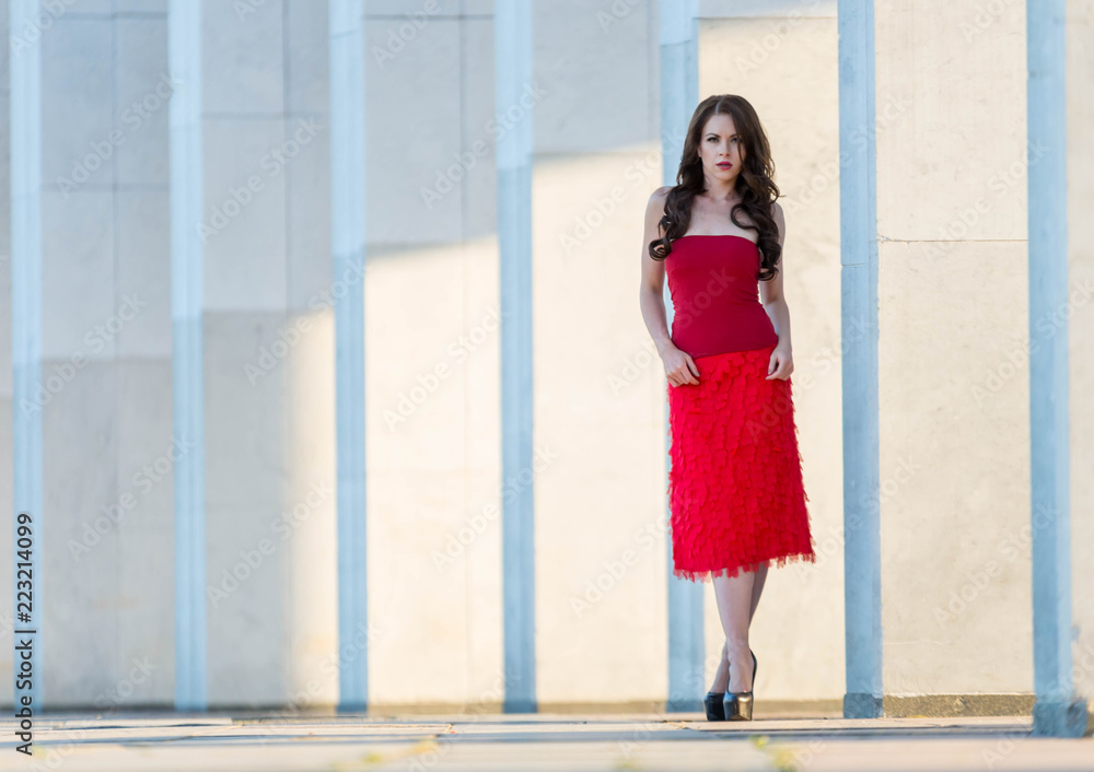 Beautiful young girl in red walking around the Mall Beautiful young girl in red walking around the Mall