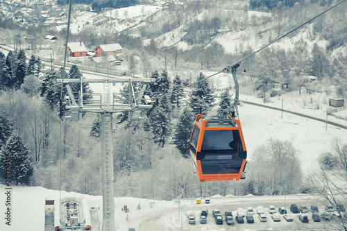 Cableway in a winter landscape in the mountains of Romania. photo