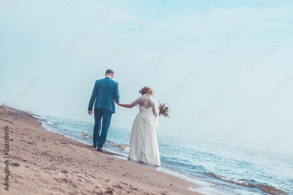 Wife and husband happy together on the beach seaside copy space Wife and husband happy together on the beach seaside copy space