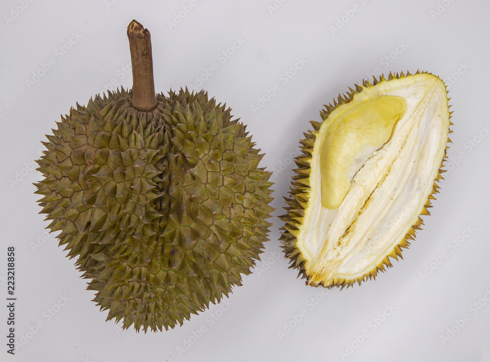 Fototapeta premium Whole and cut durian on white background. Cut durian flat lay banner template with text place. Exotic fruit durian